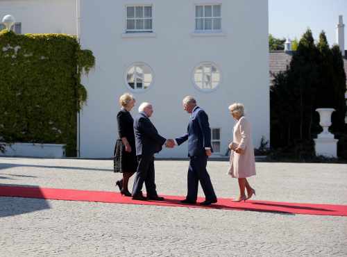 President Michael D Higgins and his wife Sabina Higgins greeting the Duchess of Cornwall and HRH The Prince of Wales as they arrived at Áras an Uachtaráin