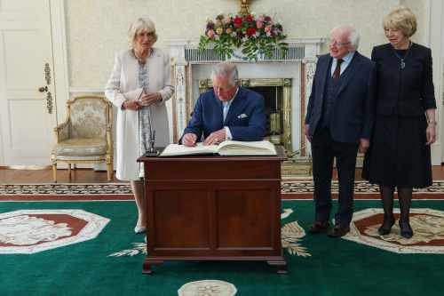 Duchess of Cornwall, HRH The Prince of Wales as they sign the guestbook at Áras an Uachtaráin