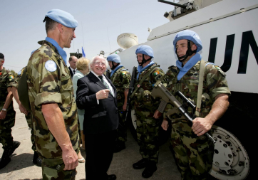 Lt Col Kevin McCarthy from Galway, President Michael D Higgins meeting Gunner Patrick Byrne from Cork and Private Vincent Rodgers from Limerick, members of the 47th Infantry Group